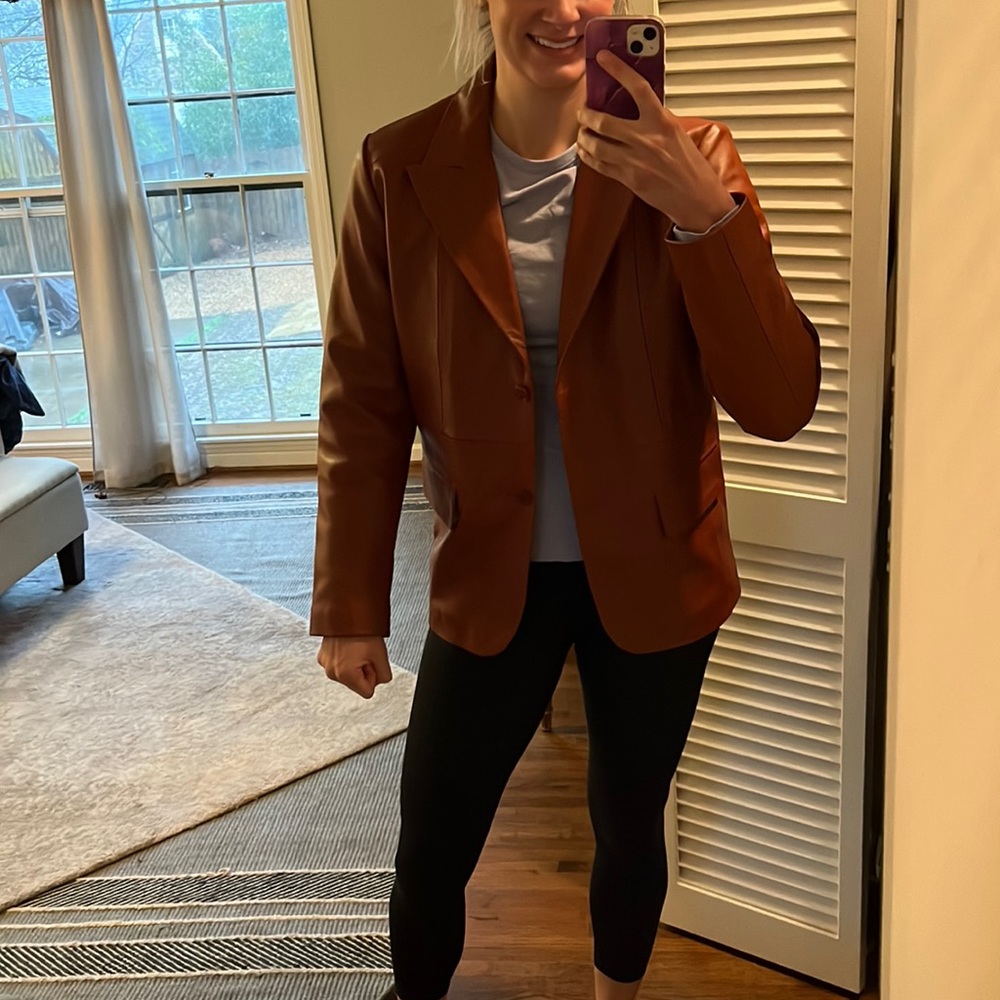 Reddish brown leather jacket. Ladies large.